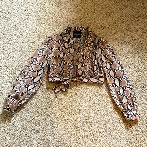 Kittenish snake pattern crop top. New with tags!